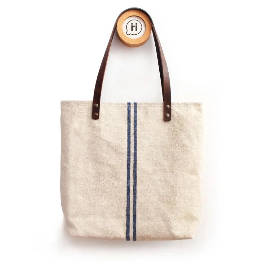Sac rustique à rayures bleues et poignées en cuir, vue de face