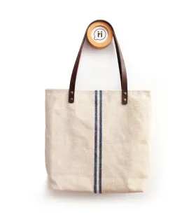 Rustic bag with blue stripes and leather handles, front view
