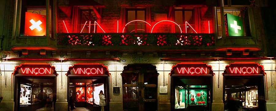 Facade of the former Vinçon shop in Barcelona with illuminated red signs
